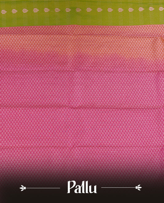 Lemon coloured soft silk saree featuring gold zari stripes and motifs across the body, enhanced with a contrast rani pink border and pallu, paired with a matching contrast blouse piece