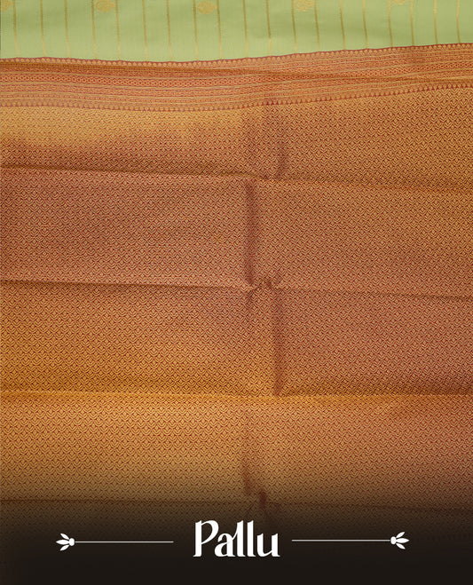 Mint green coloured soft silk saree featuring gold zari stripes and motifs across the body, enhanced with a contrast Maroon border and pallu, paired with a matching contrast blouse piece.