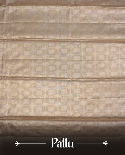 Light Gold colour semi tissue silk saree featuring gold zari pattern on body, self colour with gold zari traditional border, paired with matching blouse piece.