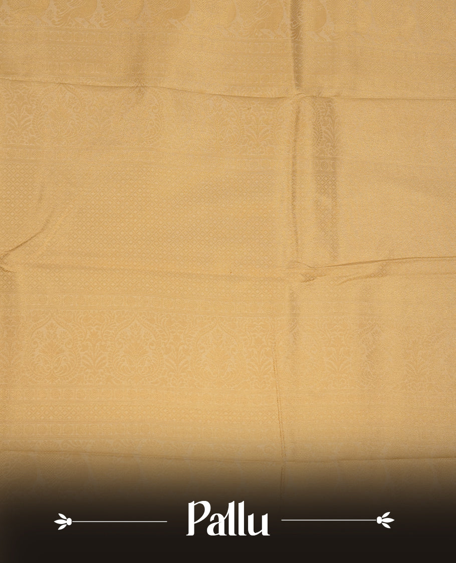 Beige colour semi soft silk saree featuring gold zari motifs on across body, self colour border with traditional gold zari pattern, pallu and paired with matching blouse.