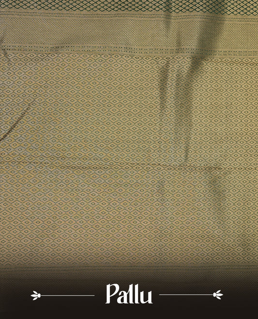 Dark green colour semi soft silk saree featuring gold zari motifs on across body, self colour border with traditional gold zari pattern, pallu and paired with matching blouse.