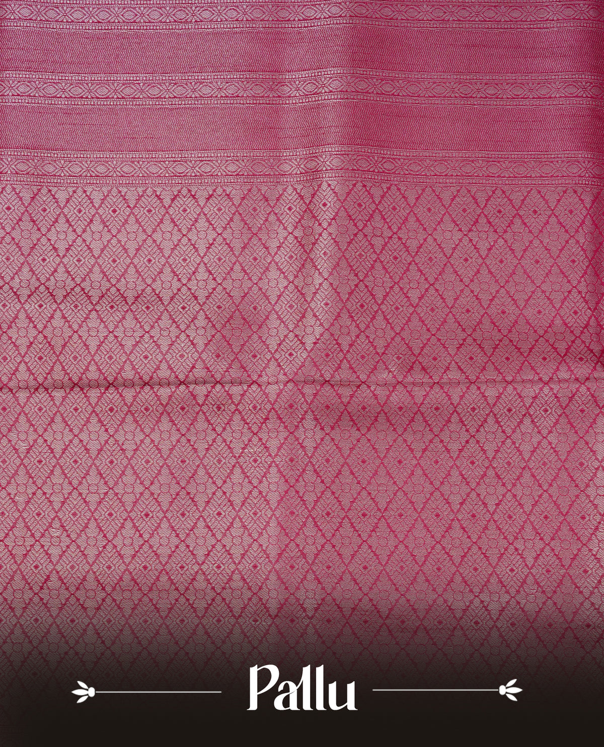 Magenta colour softie silk saree featuring silver zari, rich pallu floral brocade body, with contrasting self colour border.paired with matching blouse piece.