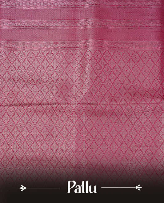 Magenta colour softie silk saree featuring silver zari, rich pallu floral brocade body, with contrasting self colour border.paired with matching blouse piece.