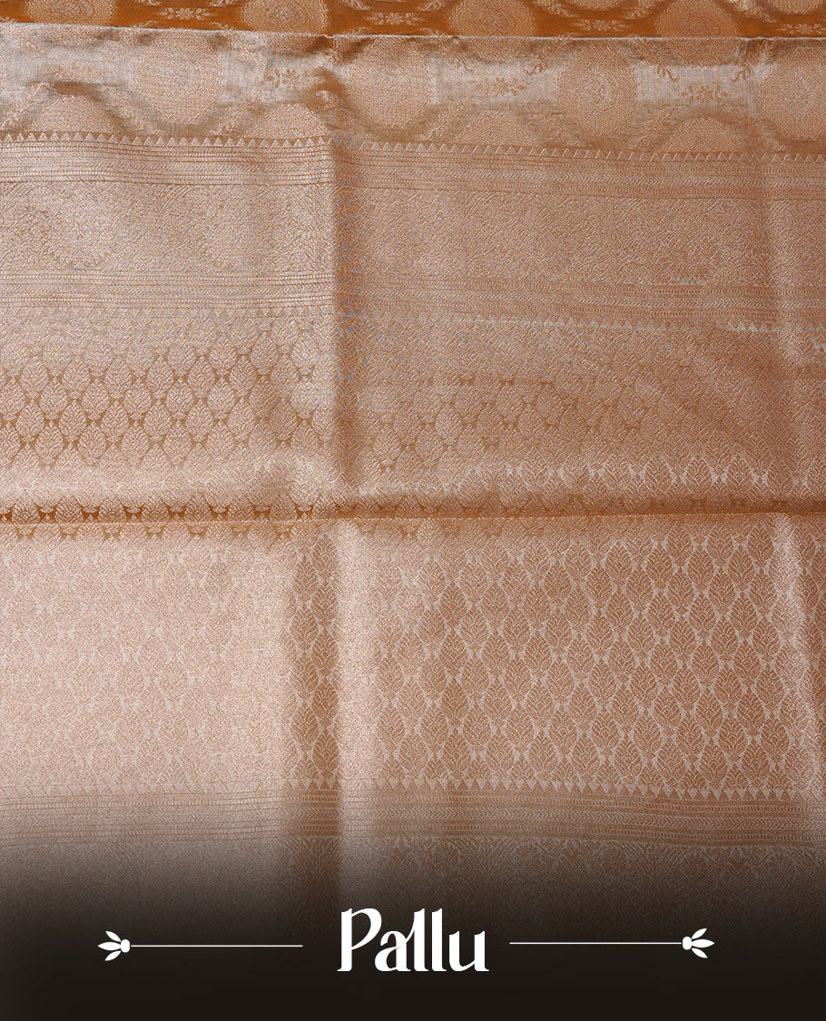 Pastel yellow colour semi tissue silk saree featuring floral zari motifs on body, complemented by gold zari traditional border, paired with matching blouse piece.