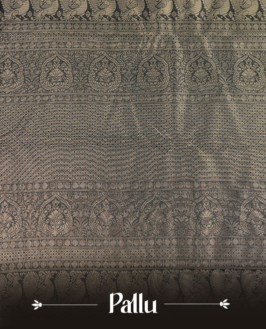 Black colour soft silk saree featuring gold zari pattern on body, complemented by self colour with traditional border, paired with matching blouse piece.