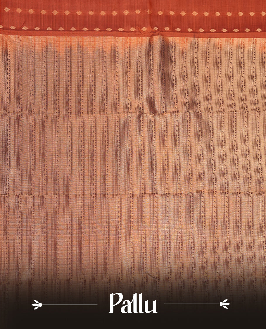Burned orange colour Soft silk saree featuring gold zari motifs on the body, complemented by a contrast chocolate brown traditional zari border and pallu, paired with a matching blouse piece.