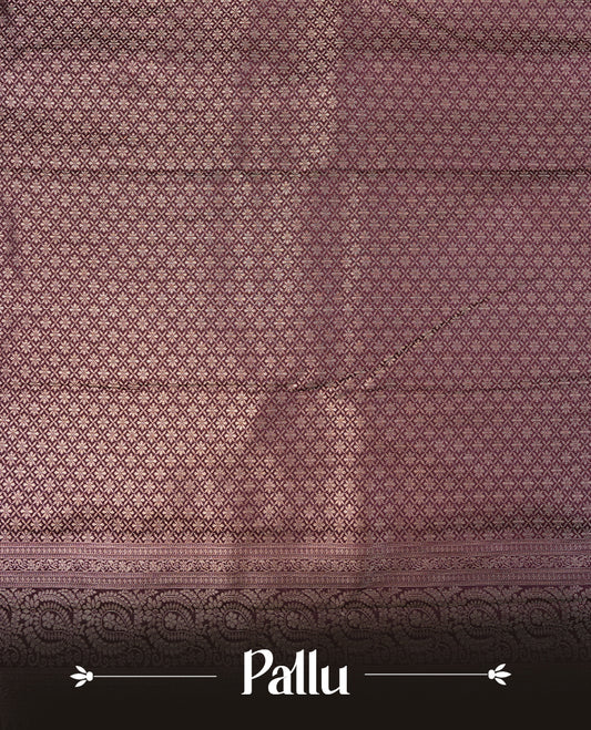 Cream colour semi wedding saree featuring gold zari floral kode pattern on body, complemented by contrast burgundy with traditional border, paired with matching blouse piece.