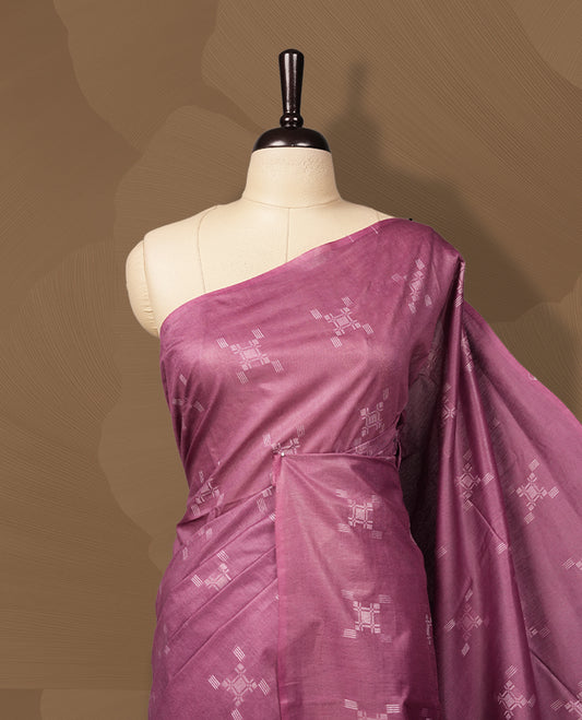 Mauve colour semi jute saree adorned with subtle thread motifs across the body & Features a soft sheen, woven geometric pallu, sleek border, and comes with a matching blouse piece for a graceful ensemble.