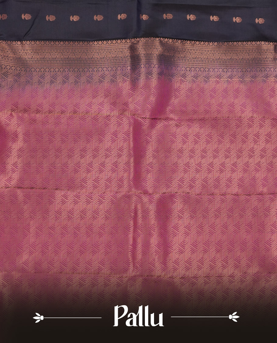 Navy blue colour Soft silk saree featuring gold zari motifs on the body, complemented by a contrast magenta traditional zari border and pallu, paired with a matching blouse piece.