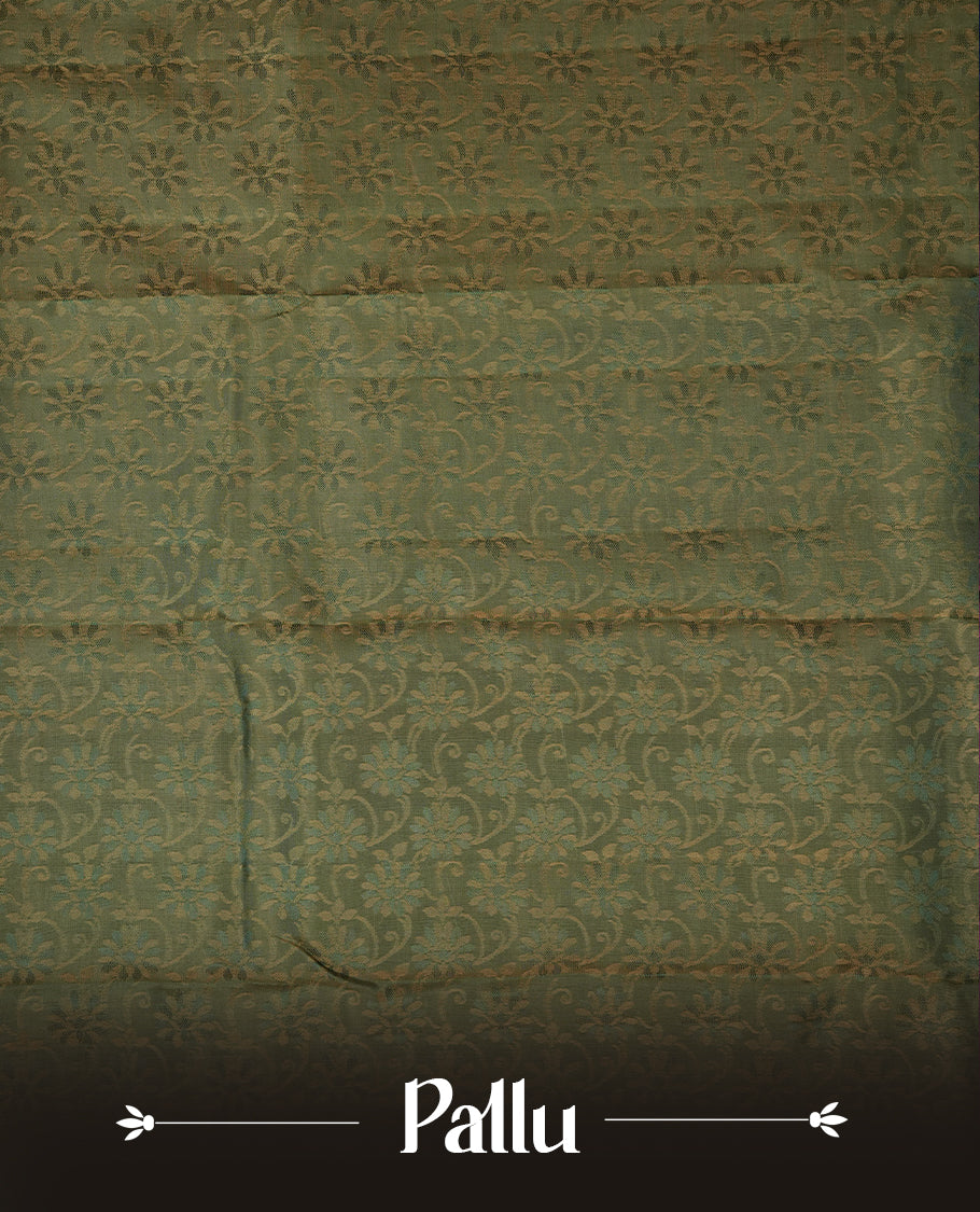 Light gold colour soft silk saree featuring gold zari motifs on the body, complemented by a contrast green zari floral kodi border and pallu, paired with a matching blouse piece.