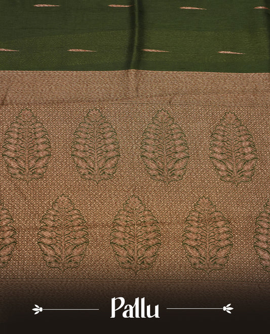 Dark green colour semi banaras tussar georgette saree featuring antique gold zari buttas on body, temple pattern on border and floral pattern on pallu, paired with matching blouse piece.