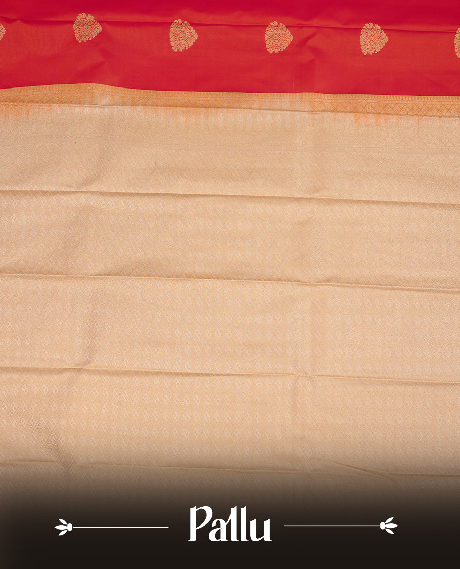 Red coloured soft silk saree featuring gold zari motifs across the body, enhanced with a contrast Cream border and pallu, paired with a matching contrast blouse piece