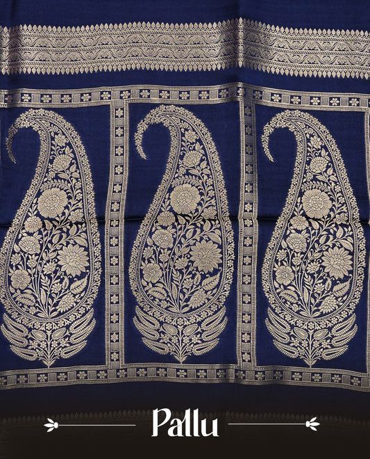 Navy blue colour Banaras satin crepe silk saree featuring Plain body, associate with Gold zari traditional border, comes with matching blouse piece.