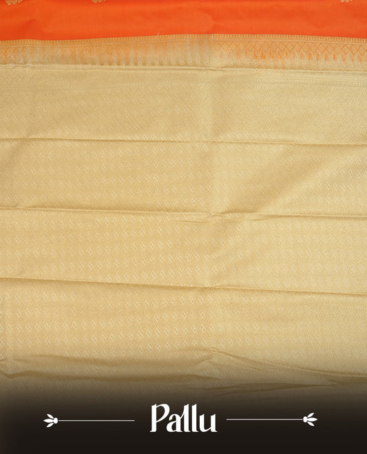 Orange coloured soft silk saree featuring gold zari motifs across the body, enhanced with a contrast Cream border and pallu, paired with a matching contrast blouse piece.