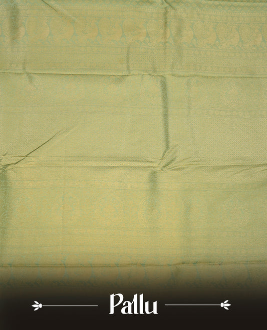 Ice green colour semi soft silk saree featuring gold zari motifs on across body, self colour border with traditional gold zari pattern, pallu and paired with matching blouse.