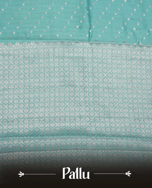 Pastal blue colour banaras soft silk saree featuring silver zari dotted stripes on body, self colour border with silver horse pattern, pallu and paired with matching blouse.