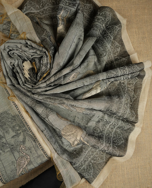 Beige & Black colour suit material adorned with intricate woven patterns, bird print & subtle motifs, exuding ethnic grace & paired with a beautifully bordered dupatta and a matching plain bottom.