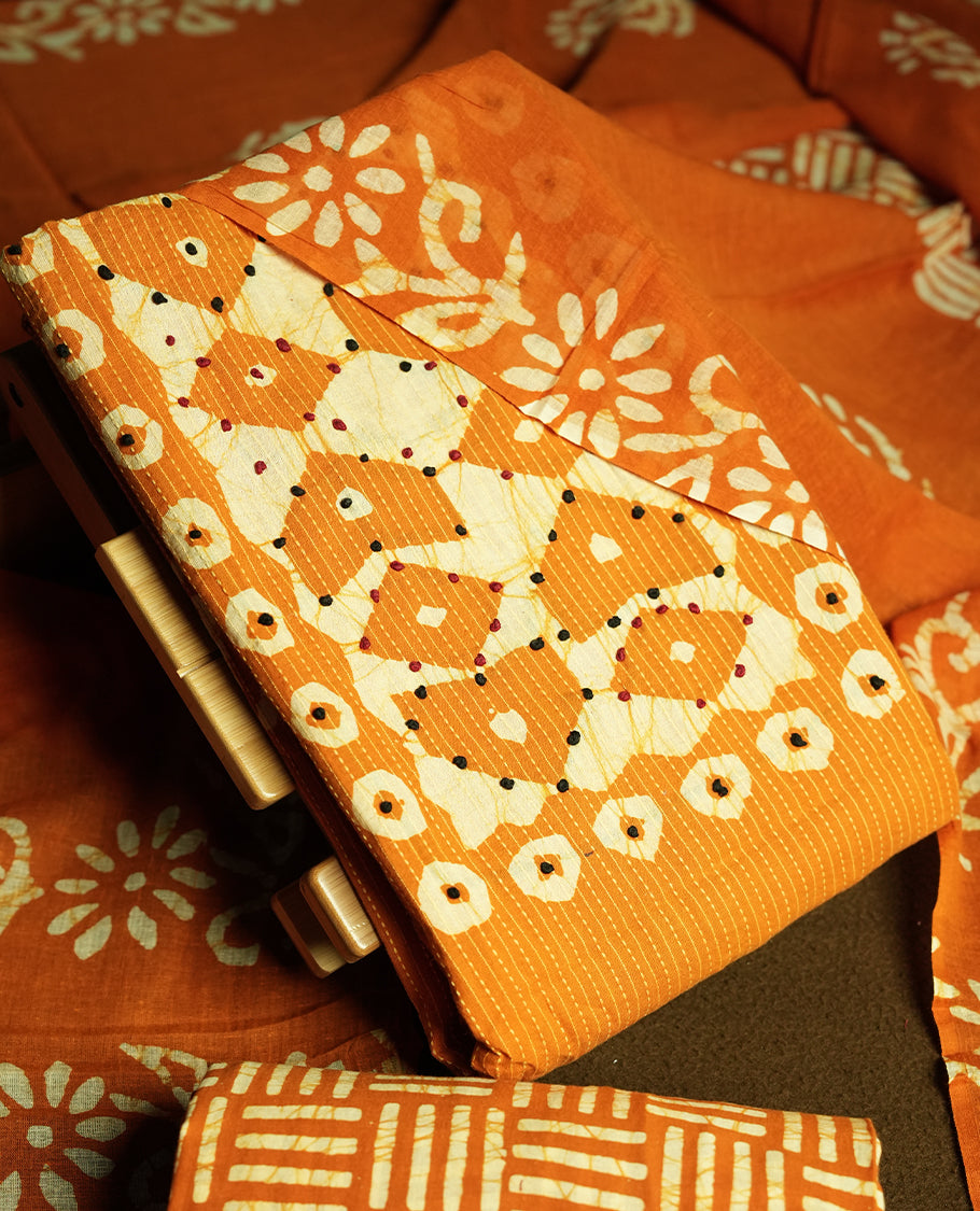 Mustard yellow & Off white cotton churidar material adorned with thread work on the neckline, featuring traditional tie dye patterns and a stripped body & Comes with a matching printed dupatta and coordinated printed fabric for the bottom.