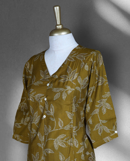 Mustard yellow colour cord set with elegant leaf motifs, featuring a V neck top with button detailing and matching straight fit pants.