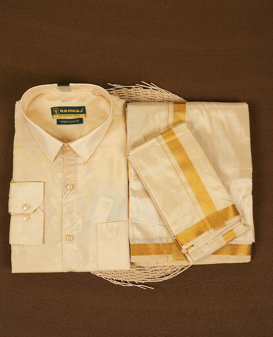 RAMRAJ Fresh Peach Colour shirt paired with a matching dhoti and towel, all elegantly finished with a gold border.
