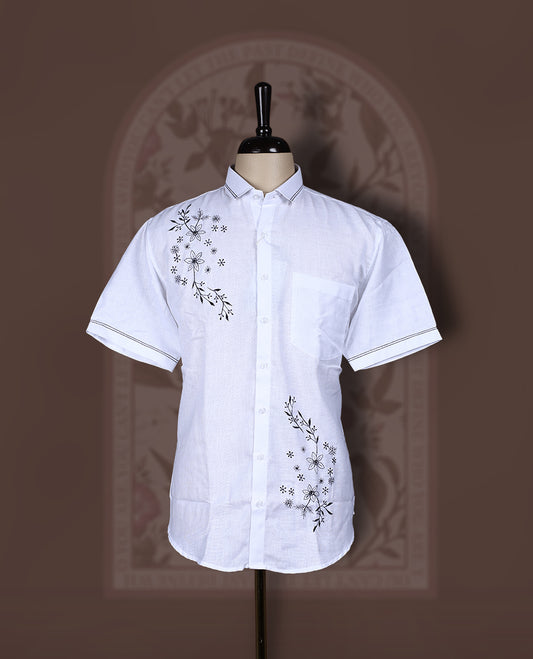 White colour Cotton linen shirt with black colour floral embroidery and smart short sleeves, Lightweight and breathable, perfect for casual or semi formal looks with an artisanal touch.