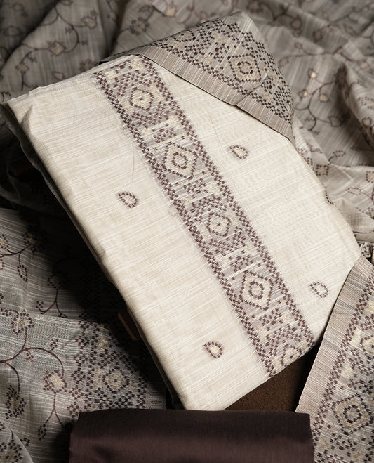 Cream colour churidhar material featuring Brown colour thread embroidery on the front panel, floral thread pattern dupatta with elegant border, and matching plain bottom.