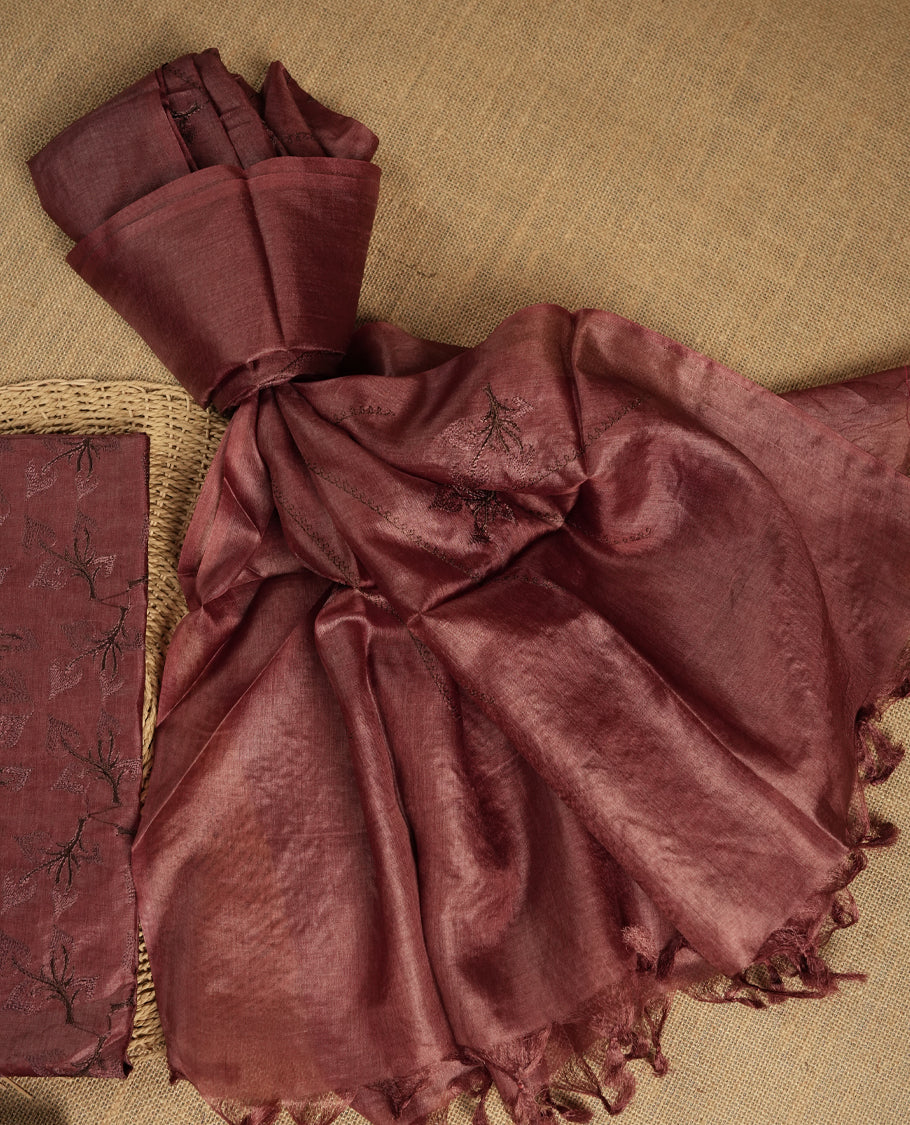 Chocolate brown colour tussar suit material adorned with intricate elegant embroidery work, exuding ethnic elegance & Paired with a beautifully embroidery dupatta and a matching plain bottom.