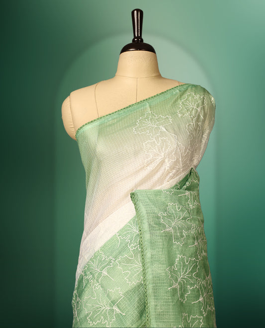 Light Green and White colour saree featuring delicate floral threadwork on the border and pallu, with a subtle ombre effect on the body, paired with a matching blouse