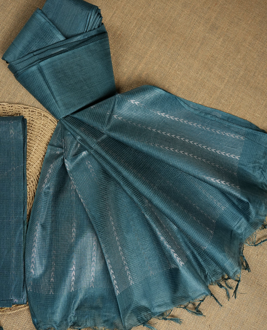 Steel blue colour Tussar suit material adorned with intricate woven patterns and subtle motifs, exuding ethnic elegance & Paired with a beautifully bordered dupatta and a matching plain bottom.