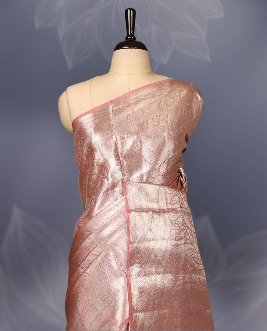 Pastel Onion colour Pure tissue Banaras saree featuring intricate silver zari weaving all over with a rich pallu and bold paisley motifs, offering a luxurious drape perfect for weddings, festive occasions, and grand celebrations