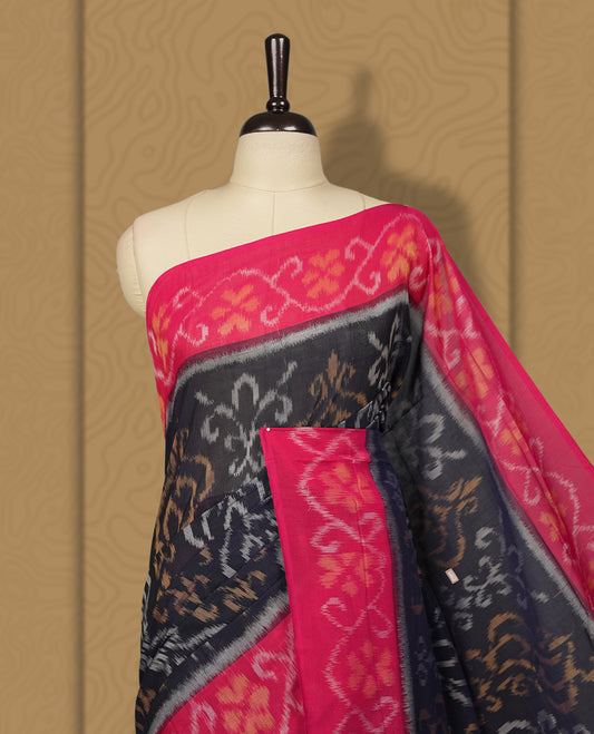 Navy blue colour Ikkat Pochampally saree featuring bold geometric motifs in beige, mustard, and grey with a striking contrast border, beautifully blending tradition with elegance, Comes with matching blouse.