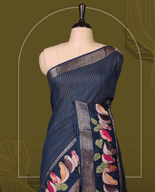 Navy Blue viscose saree featuring subtle checkered patterns and a beautifully embroidered bird motif border, paired with a rich pallu & perfect for festive occasions, celebrations, and elegant gatherings.
