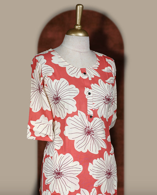 Soft Peach colour coord set adorned with all over off white colour floral prints, featuring a straight cut kurta with round neckline and 3/4th sleeves, paired with matching bottoms.