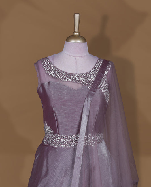 Dusty mauve colour stitched gown set with sleeveless embellished yoke, sheer studded back, flared layered hem with scalloped edge, and matching plain sheer dupatta.