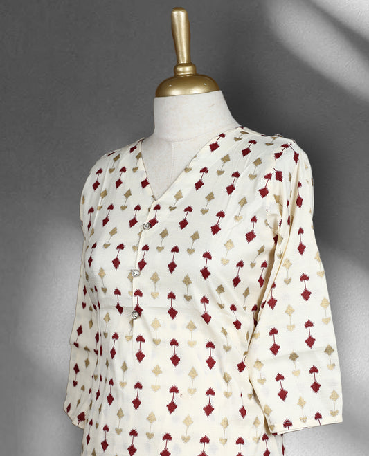 Off white colour cord set with subtle maroon and golden colour geometric prints, featuring a V neck top with a straight cut design and matching pants.