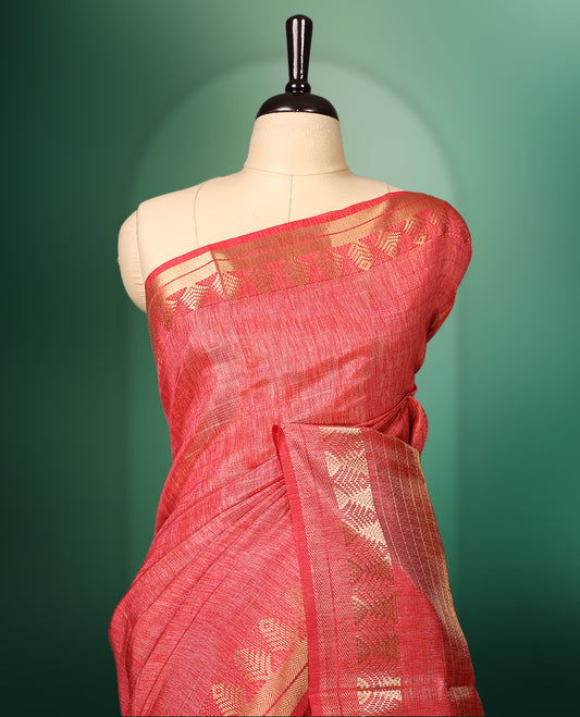 Peach Pink colour saree featuring subtle golden woven motifs on the body, complemented with a rich golden zari border and pallu, and paired with a matching blouse