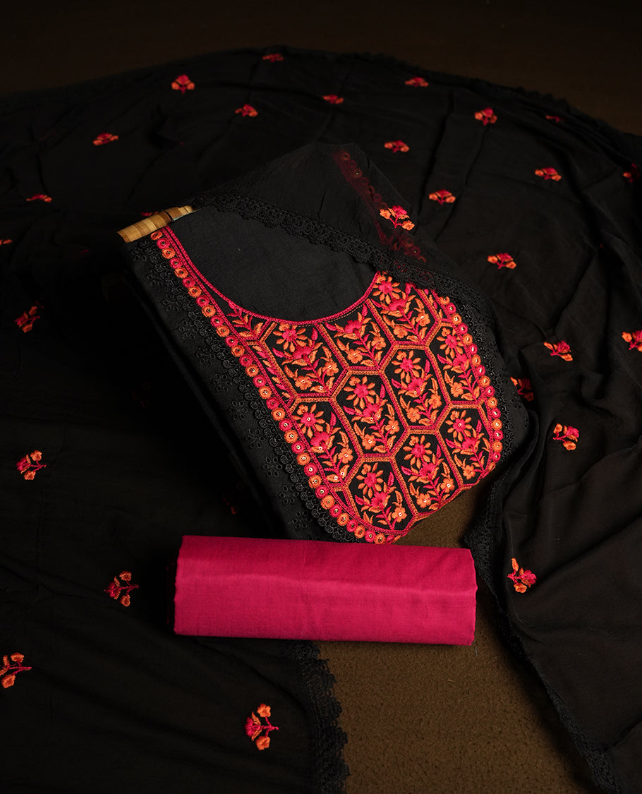 Black colour hakoba churidhar material featuring beautiful magenta and orange floral embroidery on the neckline and front panel, highlighted with lace detailing & Comes with an embroidered dupatta and contrast magenta colour bottom.
