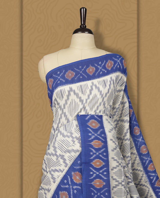 Off white and blue colour Ikkat Pochampally saree featuring intricate geometric patterns on the body, complemented by a vibrant blue border with traditional motifs for an elegant look.