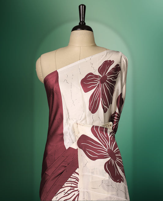 Deep Red and White semi modal saree featuring bold oversized floral prints across the body and pallu, crafted in a smooth fabric for a chic contemporary look, paired with a matching blouse.