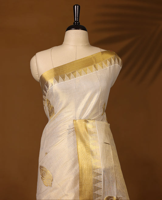 Elegant Kerala Kasavu saree in ivory with golden zari work. Perfect for festivals, weddings, and traditional events, Pair with a contrast blouse and gold jewelry for a timeless, graceful look.