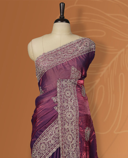 Onion pink colour velvet chiffon designer saree in elegant two tone shades, featuring light gold zari, kodi work with handwoven style thread aari & dori embroidery work, Swarovski stone work and all over motifs, comes with matching blouse.
