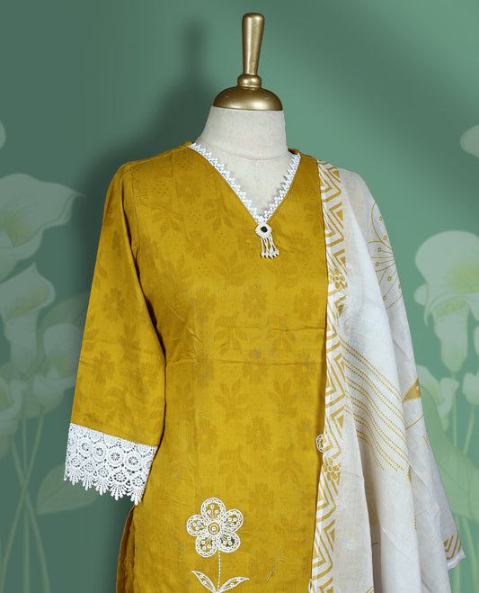 Yellow and white colour churidar set featuring elegant white thread embroidery on the neckline, sleeves with white lace border, and white floral motifs across the body, Paired with a contrast white colour dupatta