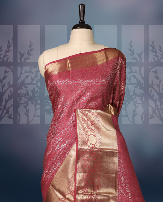 Deep pink semi silk brocade saree with intricate gold zari brocade work and a rich gold woven border and pallu, Comes with a matching blouse, perfect for festive occasions and traditional celebrations.