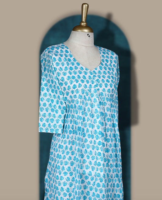 Off white colour kurthi with sky blue floral block print, round neckline, and 3/4th sleeves & Perfect for casual wear or work from home comfort, Style with leggings or wear solo for a chic look.