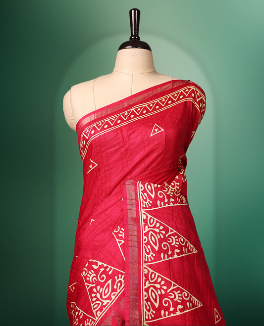 Red Colour saree featuring bold geometric and ethnic inspired prints all over the body, enhanced with a matching printed border, complemented by a striking patterned pallu, and paired with a matching blouse
