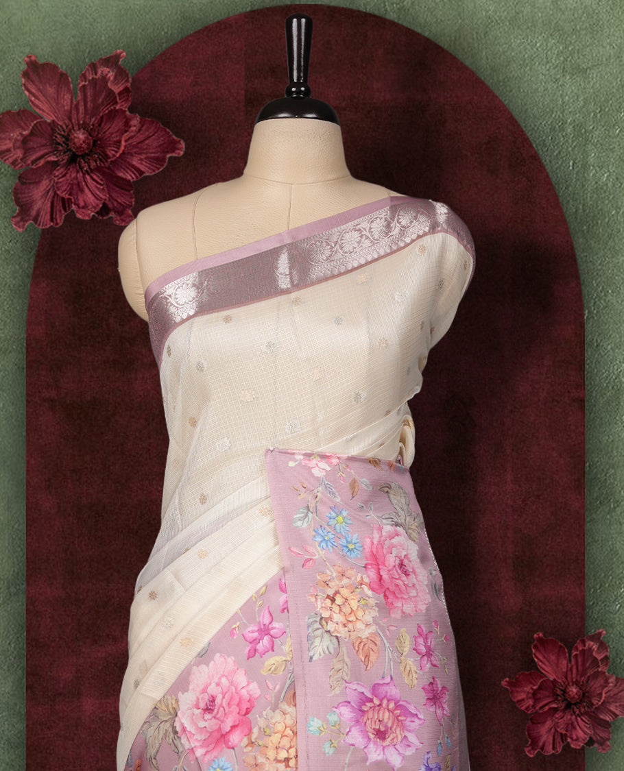Ivory colour Kotta Tussar Silk saree features a vibrant digital floral print with small gold zari motifs on the body, and elegant pink colour banarasi border & Paired with a matching blouse,blending modern design with traditional elegance.