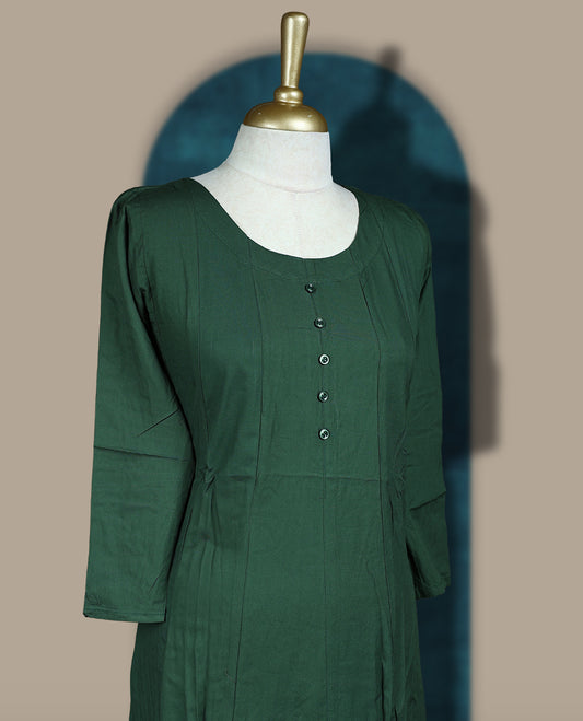 Deep green colour cotton kurthi with front buttons and 3/4th sleeves & Features a round neck and minimalist design for a classy everyday look, Ideal for work or casual wear with maximum comfort.