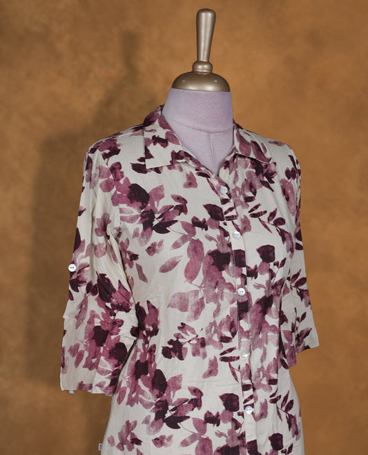 Ivory colour shirt style kurti BY VISMAY with maroon floral prints, featuring a button down front, three-quarter roll up sleeves, and a curved calf length hem.