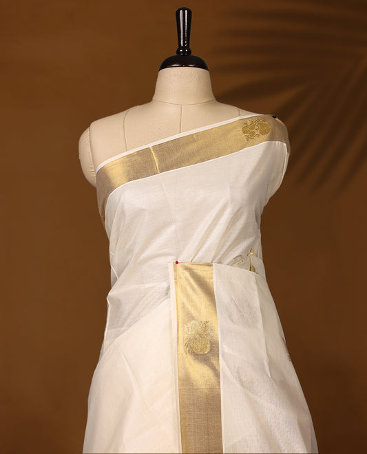 Elegant Kerala Kasavu saree with a golden border and intricately woven pallu, The ivory base adds a touch of grace, perfect for festive occasions, Style with a contrast blouse for a timeless traditional look.