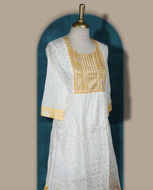 White and soft yellow kurti featuring delicate floral embroidery, a square neckline, 3/4 sleeves, and a flared hem & Perfect for casual outings or festive wear with its breezy, stylish look.